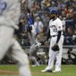 Milwaukee Brewers&#39; Jeremy Jeffress (32) watches after giving up a three-run home run to Los Angeles Dodgers&#39; Yasiel Puig during the sixth inning of Game 7 of the National League Championship Series baseball game Saturday, Oct. 20, 2018, in Milwaukee. (AP Photo/Jeff Roberson)