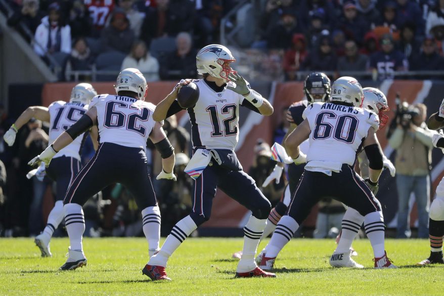 New England Patriots quarterback Tom Brady (12) throws during the first half of an NFL football game against the Chicago Bears Sunday, Oct. 21, 2018, in Chicago. (AP Photo/Nam Y. Huh)