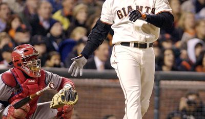 10. Barry Bonds, San Francisco Giants (2002) reached base 21 times in 30 plate appearances with a record 13 walks, a .700 on-base percentage. He went 8-for-17 with two doubles and four home runs. The San Francisco Giants&#39; Barry Bonds watches the flight of his home run against the Anaheim Angels n the 5th inning of Game 3 of the World Series in San Francisco, Tuesday, Oct. 22, 2002. (AP Photo/Kevork Djansezian)
