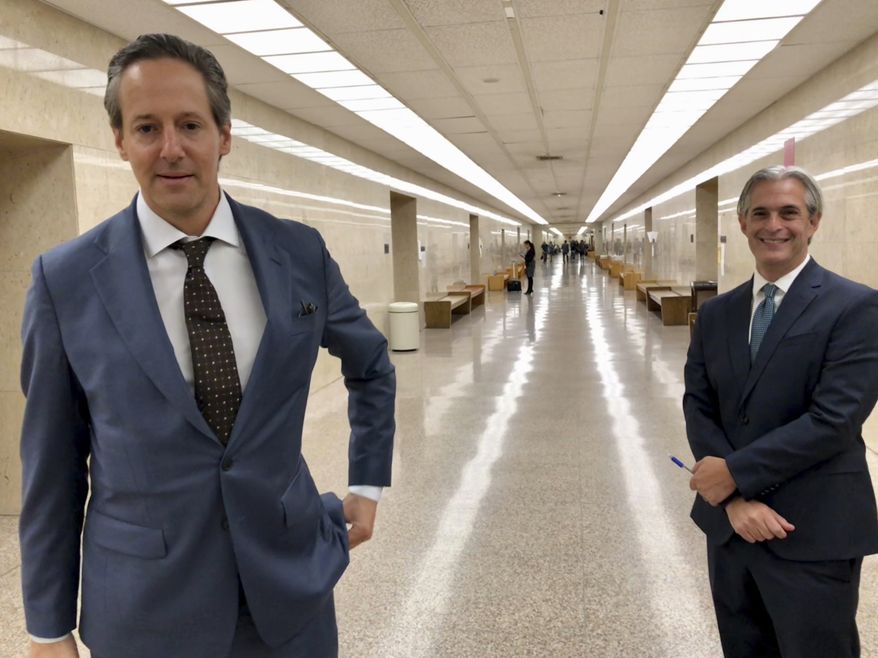 Jason Frank, right, and his attorney Eric George leave a Los Angeles County Superior Court on Monday, Oct. 22, 2108. On Monday a California judge has ordered Stormy Daniels&#39; lawyer Michael Avenatti to pay $4.85 million to Frank, an attorney at his former law firm. The judge said Avenatti must pay the money because he personally guaranteed a settlement with Frank in a lawsuit over back pay. (AP Photo/Amanda Lee Myers)