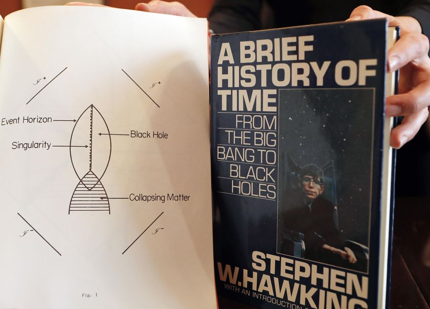 A book and scripts are among the personal and academic possessions of Stephen Hawking at the auction house Christies in London, Friday, Oct. 19, 2018. (AP Photo/Frank Augstein) ** FILE **