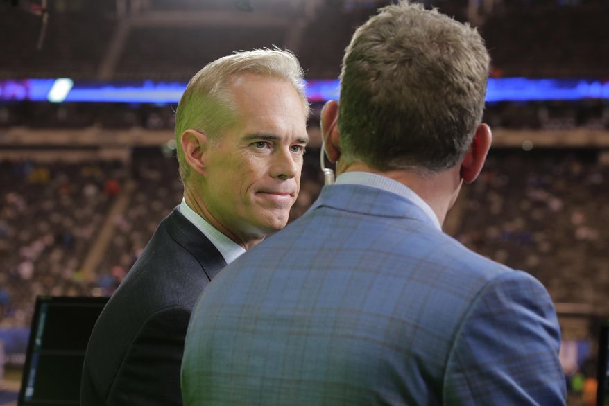 Joe Buck, left, talks to Troy Aikman before an NFL football game between the New York Giants and the Philadelphia Eagles on Thursday, Oct. 11, 2018, in East Rutherford, N.J. The World Series comes in the midst of the busiest month of Buck’s 25-year career at Fox. He normally does only baseball once the League Championship Series begin, but he has added Thursday Night Football to his schedule. If the World Series does go the distance, Buck will be doing 18 games over a 22-day stretch. Buck said that it is grind he is used to from his years doing St. Louis Cardinals baseball games on radio and television. (AP Photo/Frank Franklin II) ** FILE **