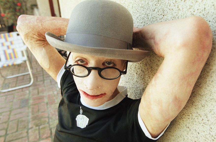 FILE - In this Feb. 22, 1997 file photo, David Rothenberg poses for a portrait in Los Angeles. Medical examiners in Las Vegas have determined that the death in July, 2018, of artist Dave Dave, who was born David Rothenberg, at age 42 was from natural causes. (AP Photo/Susan Sterner, file)