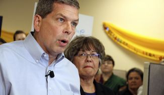 FILE - In this Sept. 4, 2018 file photo, Democrat Mark Begich, left, shown with his lieutenant governor running mate Debra Call, speaks during a press conference at his campaign office in Anchorage, Alaska. On Oct. 19, Gov. Bill Walker announced he was dropping his bid for re-election, though his name remains on the ballot. He threw his support behind Begich, leaving him as the sole opponent to Republican Mike Dunleavy. (AP Photo/Mark Thiessen, File)