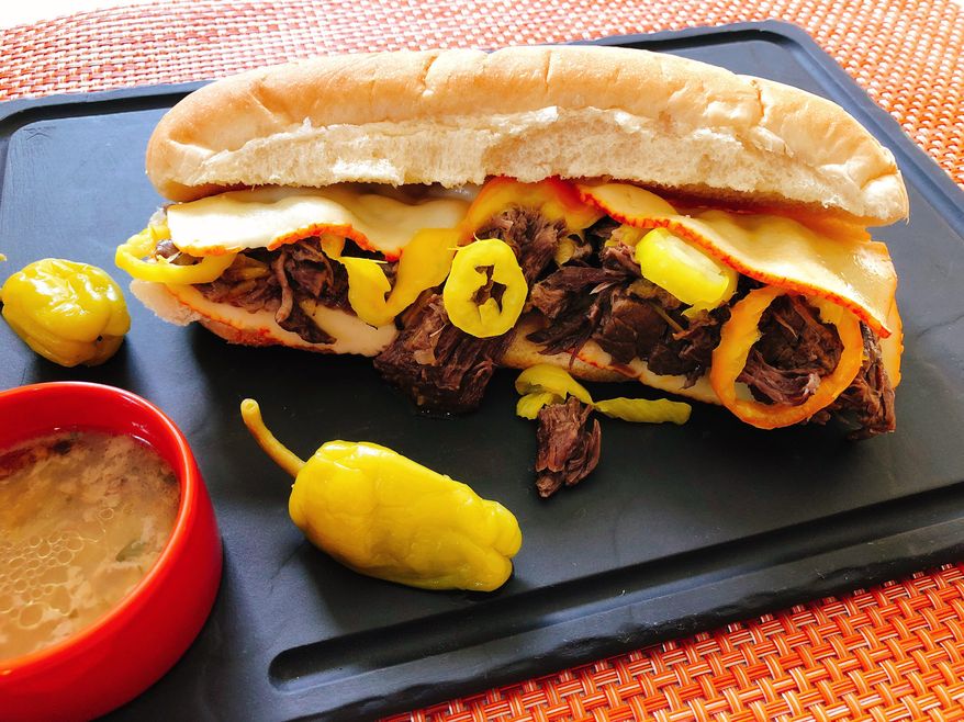 This Tuesday, Oct. 16, 2018 photo shows a pickled pepper pull-apart beef hoagie in Amagansett, N.Y. this dish is from a recipe by Elizabeth Karmel. (Elizabeth Karmel via AP)