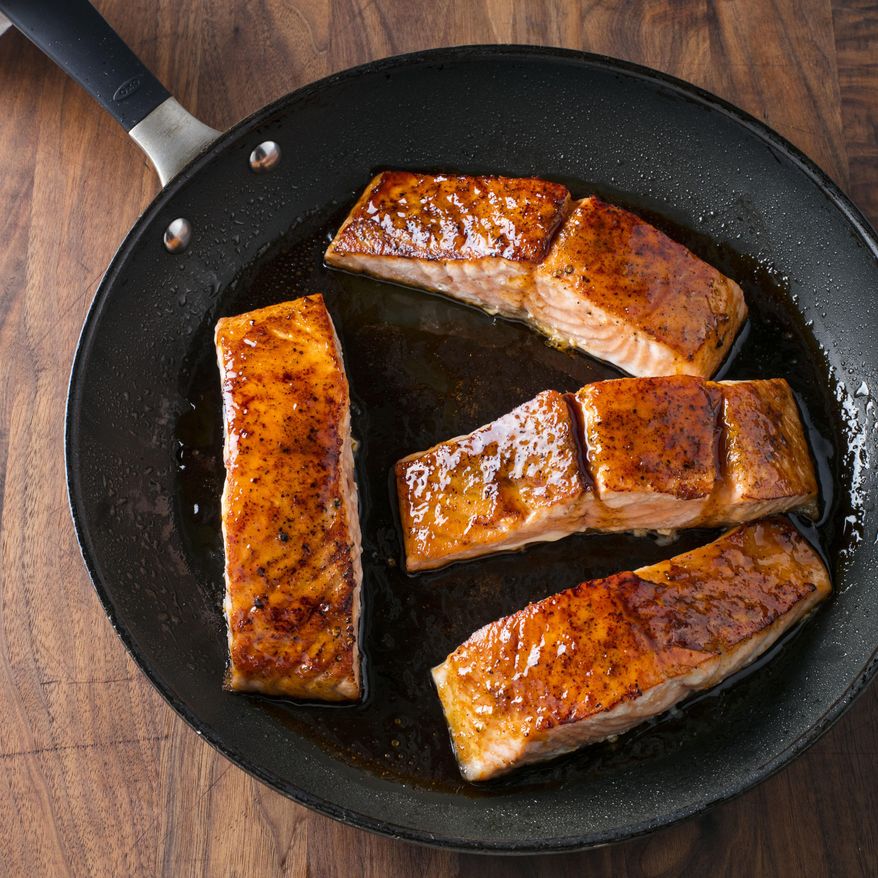 This undated photo provided by America's Test Kitchen in October 2018 shows honey-lime glazed roast salmon in Brookline, Mass. This recipe appears in the cookbook “How to Roast Everything.” (Steve Klise/America's Test Kitchen via AP)