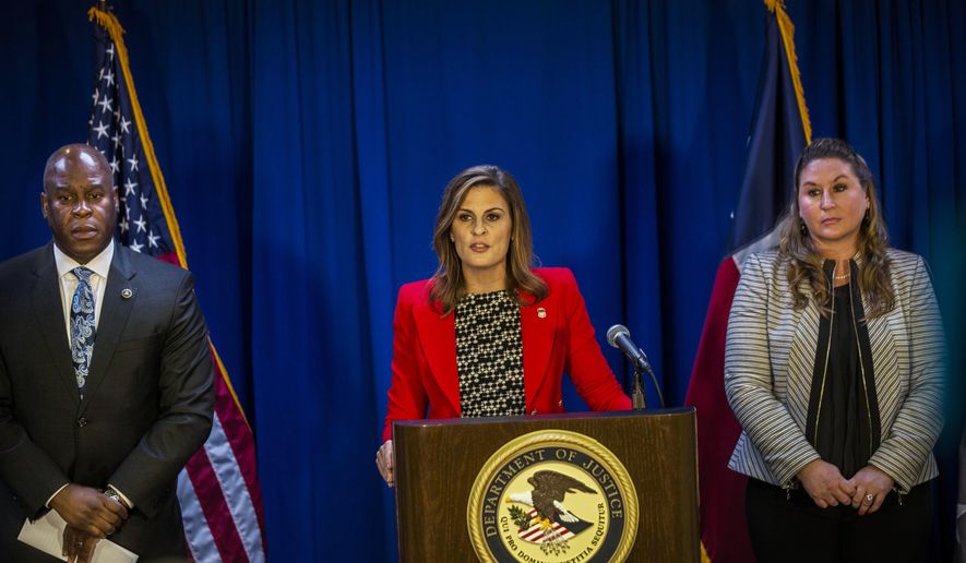 U.S. Attorney Erin Nealy Cox, center, speaks on the guilty plea of former Dallas County Schools president Larry Duncan alongside FBI Special Agent-in-Charge Eric Jackson, left, and IRS Dallas Field Office Special Agent in Charge Tamera Cantu at Earle Cabell Federal building in Dallas, on Monday, Oct. 22, 2018. Duncan pleaded guilty to tax evasion. (Carly Geraci/The Dallas Morning News via AP)
