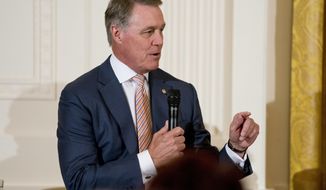 FILE - In an Aug. 20, 2018 file photo, Sen. David Perdue, R-Ga., speaks at a roundtable during an event to salute U.S. Immigration and Customs Enforcement (ICE) officers and U.S. Customs and Border Protection (CBP) agents at the White House in Washington. A Georgia Tech student is suing U.S. Sen. David Perdue, accusing the politician of snatching a cellphone from him during a campaign event in Atlanta. (AP Photo/Andrew Harnik, File)
