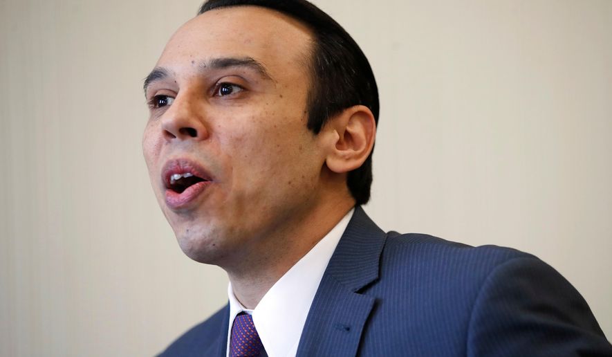 FILE - In this Feb. 1, 2018, file photo, Roger Severino, director of the Office for Civil Rights, is interviewed at the office of Health and Human Services in Washington. LGBT leaders across the U.S. reacted with fury on Oct. 22, to a report that the Trump administration is considering adoption of a new definition of gender that would effectively deny federal recognition and civil rights protections to transgender Americans. (AP Photo/Jacquelyn Martin, File)