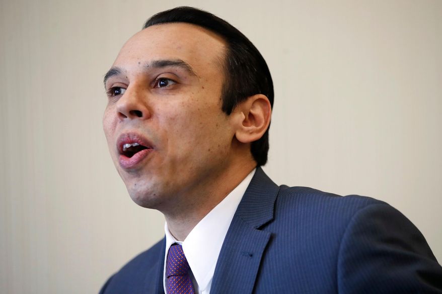 FILE - In this Feb. 1, 2018, file photo, Roger Severino, director of the Office for Civil Rights, is interviewed at the office of Health and Human Services in Washington. LGBT leaders across the U.S. reacted with fury on Oct. 22, to a report that the Trump administration is considering adoption of a new definition of gender that would effectively deny federal recognition and civil rights protections to transgender Americans. (AP Photo/Jacquelyn Martin, File)