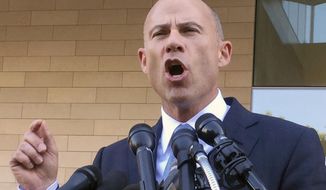 In this Sept. 24, 2018, file photo, Michael Avenatti, attorney for porn actress Stormy Daniels, talks to reporters after a federal court hearing in Los Angeles. A California judge on Monday, Oct. 22, ordered Avenatti to pay $4.85 million to an attorney at his former law firm--the first time the potential presidential candidate is being held personally liable in the case. (AP Photo/Amanda Lee Myers) **FILE**