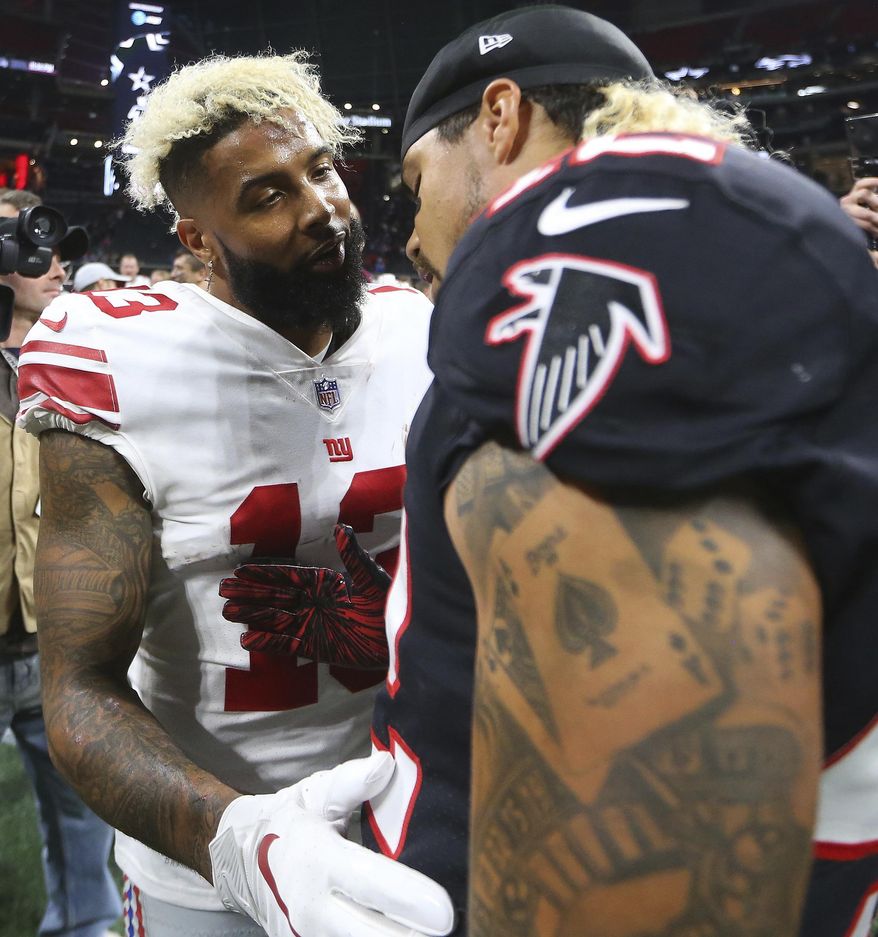 New York Giants wide receiver Odell Beckham (13) and Atlanta Falcons linebacker Duke Riley (42) talk after an NFL football game, Monday, Oct. 22, 2018, in Atlanta. The Atlanta Falcons won 23-20. (AP Photo/John Bazemore)