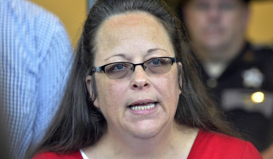 In this Sept. 14, 2015, file photo, then-Rowan County Clerk Kim Davis makes a statement to the media at the front door of the Rowan County Judicial Center in Morehead, Ky. (AP Photo/Timothy D. Easley, File)