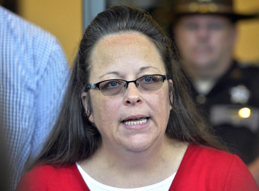 In this Sept. 14, 2015, file photo, then-Rowan County Clerk Kim Davis makes a statement to the media at the front door of the Rowan County Judicial Center in Morehead, Ky. (AP Photo/Timothy D. Easley, File)