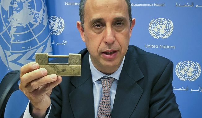 Tomas Ojea Quintana, the United Nations special investigator on human rights in North Korea, holds up a lock given to him by North Koreans who escaped from the country, during a press conference, Tuesday Oct. 23, 2018, at U.N. headquarters in New York. Quintana said the escapees told him: &amp;quot;You have the key to open the lock,&amp;quot; and that he was &amp;quot;very concerned&amp;quot; that human rights were not mentioned in the statements after the summits between the leaders of North Korea and South Korea or between North Korean leader Kim Jong Un and U.S. President Donald Trump. (AP Photo/Edith M. Lederer)
