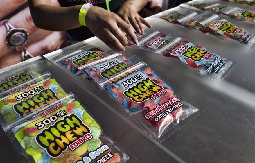 In this Saturday, Oct. 20, 2018 photo medicated High Chew edibles are shown on display and offered for sale at the cannabis-themed Kushstock Festival at Adelanto, Calif. (AP Photo/Richard Vogel)