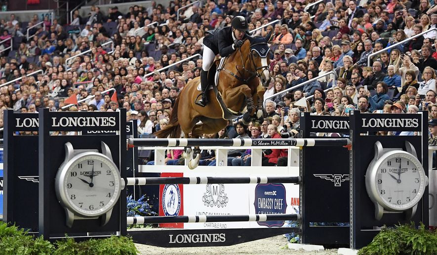American show jumper and Olympic gold medalist McLain Ward competes at a horse show. (Photo by Shawn McMillen Photography / Courtesy of Washington International Horse Show)