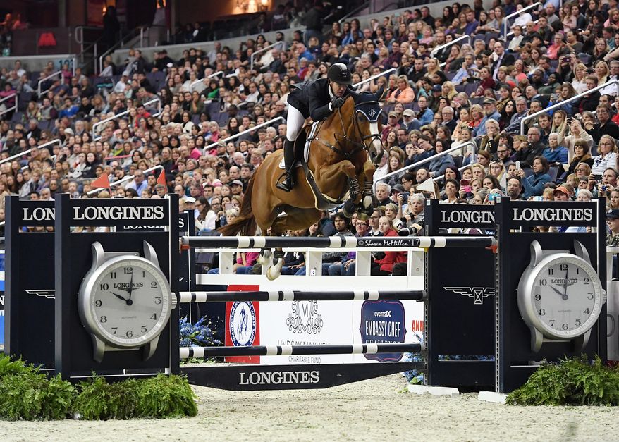 American show jumper and Olympic gold medalist McLain Ward competes at a horse show. (Photo by Shawn McMillen Photography / Courtesy of Washington International Horse Show)