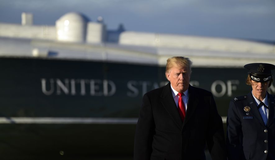 President Donald Trump walks to board Air Force One at Andrews Air Force Base in Md., Wednesday, Oct. 24, 2018. Trump is heading to Wisconsin for a rally. (AP Photo/Susan Walsh)