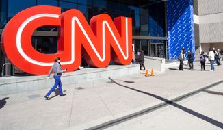 People walk outside CNN Center, Wednesday, Oct. 24, 2018, in Atlanta. CNN is now screening all people who enter after a suspicious package was delivered to CNN in New York. NYPD&#39;s chief of counterterrorism says the explosive device sent to CNN&#39;s headquarters in New York appeared to be sent by the same person who mailed pipe bombs to George Soros, Hillary Clinton and former President Barack Obama. (AP Photo/Ron Harris) **FILE**
