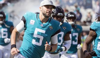 FILE - In this Sunday, Oct. 21, 2018, file photo, Jacksonville Jaguars quarterback Blake Bortles (5) takes the field before an NFL football game against the Houston Texans in Jacksonville, Fla. The Jaguars are counting on newcomer Carlos Hyde to help Bortles. (AP Photo/Stephen B. Morton, File)