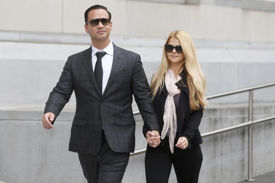 FILE - In this Oct. 5, 2018, file photo, Michael "The Situation" Sorrentino leaves federal court with his fiancee Lauren Pesce after his sentencing in Newark, N.J. A federal judge in New Jersey ruled Monday, Oct. 22, 2018, that the “Jersey Shore” star will now have until Jan. 15 to report to prison. But it’s still not clear where he'll be incarcerated. (Aristide Economopoulos/NJ Advance Media via AP, File)