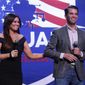 Donald Trump Jr., and Kimberly Guilfoyle appear at a rally for Republican U.S. Senate candidate John James in Pontiac, Mich., Wednesday, Oct. 17, 2018. (AP Photo/Paul Sancya)