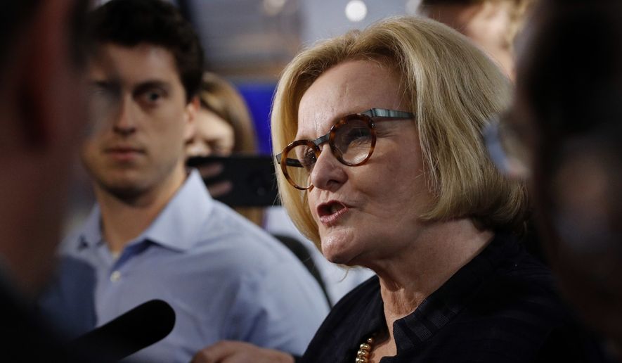 Missouri incumbent Democratic Sen. Claire McCaskill talks to the media after a debate against Republican challenger Josh Hawley  Thursday, Oct. 25, 2018, in Kansas City, Mo. (AP Photo/Charlie Riedel)