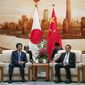 Chinese Premier Li Keqiang, right, and Japanese Prime Minister Shinzo Abe meet at the Great Hall of the People in Beijing, Thursday, Oct. 25, 2018. Abe arrived in Beijing on Thursday as both countries try to repair ties that have been riven by disputes over territory, military expansion in the Pacific and World War II history. (Roman Pilipey/Pool Photo via AP)