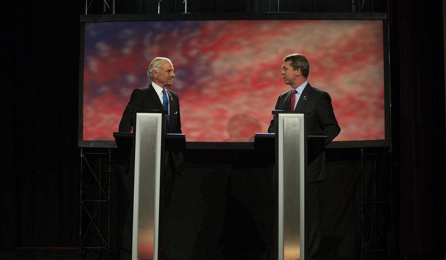 Republican Gov. Henry McMaster, left, and Democratic challenger, state Rep. James Smith meet during a debate, Thursday, Oct. 25, 2018 at Greenville Technical College in Greenville, S.C. (Lauren Petracca/The Post And Courier via AP)