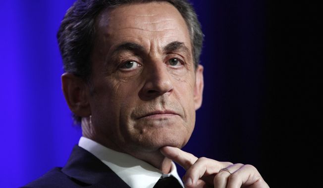 FILE - In this March 24 2015 file photo, former French President Nicolas Sarkozy attends a meeting in Asnieres, outside Paris. Sarkozy has lost an appeal against an earlier legal decision and could stand trial on charges of illegally financing his 2012 presidential campaign. (AP Photo/Thibault Camus, File)