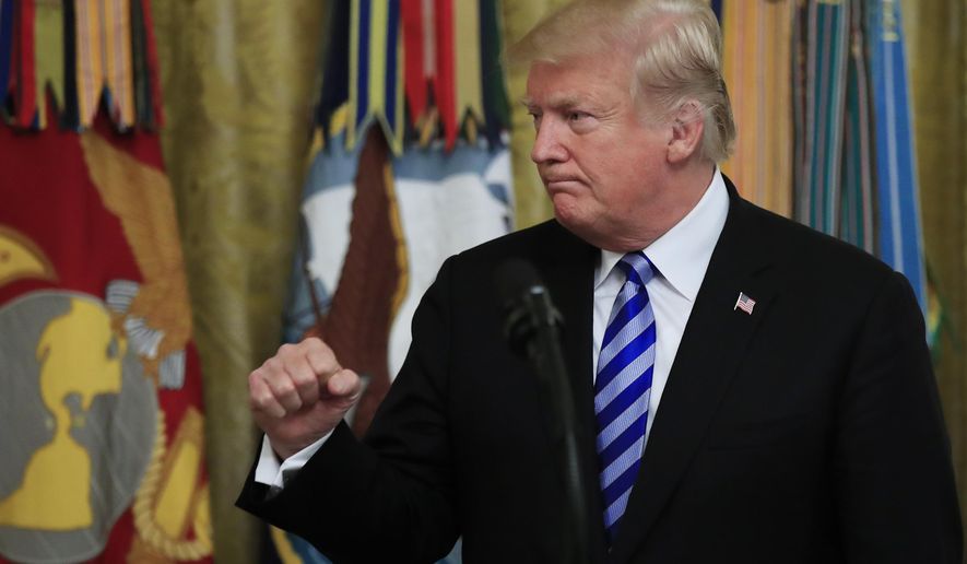 President Donald Trump gestures after giving his speech at a reception commemorating the 35th anniversary of the attack on Beirut Barracks in the East Room at the White House in Washington, Thursday, Oct. 25, 2018. (AP Photo/Manuel Balce Ceneta)