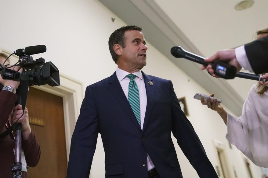 Rep. John Ratcliffe, R-Texas., speaks to media, on Capitol Hill in Washington, Thursday, Oct. 25, 2018. George Papadopoulos, the former Trump campaign adviser who triggered the Russia investigation, will speak behind closed doors to two GOP-led House committees that are investigating partisan bias at the Justice Department. (AP Photo/Carolyn Kaster)