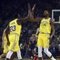 Golden State Warriors&#39; Kevin Durant, right, celebrates a score against the Washington Wizards with Draymond Green (23) during the first half of an NBA basketball game, Wednesday, Oct. 24, 2018, in Oakland, Calif. (AP Photo/Ben Margot) **FILE**