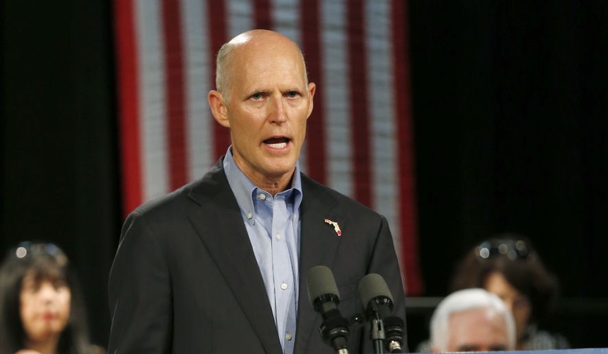 In this July 13, 2018, file photo, Florida Gov. Rick Scott, speaks to Cuban-American supporters at a campaign stop, in Hialeah, Fla. Scott is getting back on the campaign trail after spending more than two weeks dealing with the aftermath of Hurricane Michael. Despite being embroiled in a tight race with U.S. Sen. Bill Nelson, Scott has spent most of his time in the Florida Panhandle counties damaged by the deadly storm. (AP Photo/Wilfredo Lee, File)