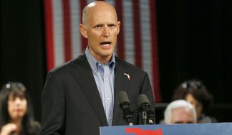 In this July 13, 2018, file photo, Florida Gov. Rick Scott, speaks to Cuban-American supporters at a campaign stop, in Hialeah, Fla. Scott is getting back on the campaign trail after spending more than two weeks dealing with the aftermath of Hurricane Michael. Despite being embroiled in a tight race with U.S. Sen. Bill Nelson, Scott has spent most of his time in the Florida Panhandle counties damaged by the deadly storm.  (AP Photo/Wilfredo Lee, File)