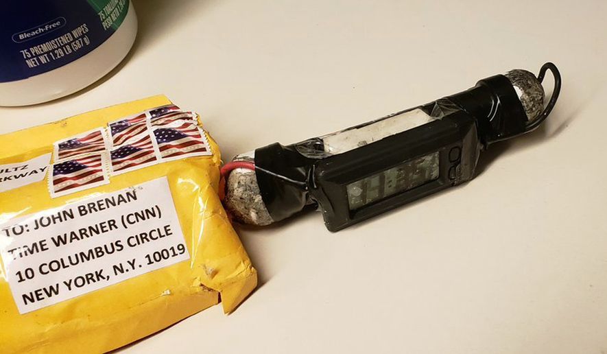 This image obtained Wednesday, Oct. 24, 2018, and provided by ABC News shows a package addressed to former CIA head John Brennan and an explosive device that was sent to CNN's New York office. (ABC News via AP)