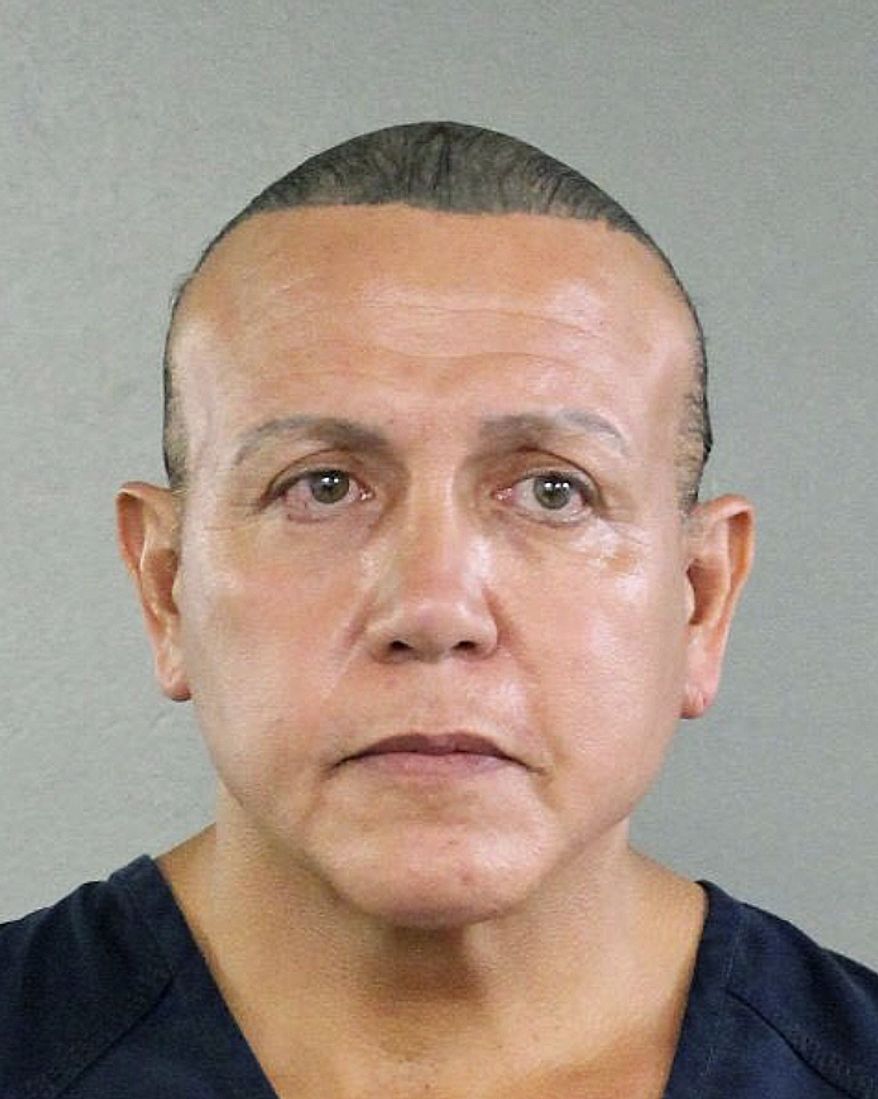 In this undated photo released by the Broward County Sheriff&#39;s office, Cesar Sayoc is seen in a booking photo, in Miami. Federal authorities took  Sayoc, 56, of Aventura, Fla., into custody Friday, Oct. 26, 2018 in Florida in connection with the mail-bomb scare that earlier widened to 12 suspicious packages, the FBI and Justice Department said. (Broward County Sheriff&#39;s Office via AP)