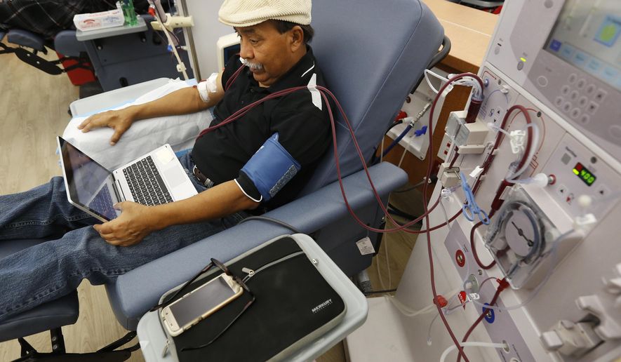 In this photo taken Monday, Sept. 24, 2018, Adrian Perez undergoes dialysis at a DaVita Kidney Care clinic in Sacramento, Calif. Dialysis companies have contributed an extraordinary $111 million and counting to defeat a California ballot initiative that would cap their profits, the most any one side has spent on a U.S. ballot issue since at least 2002. (AP Photo/Rich Pedroncelli)