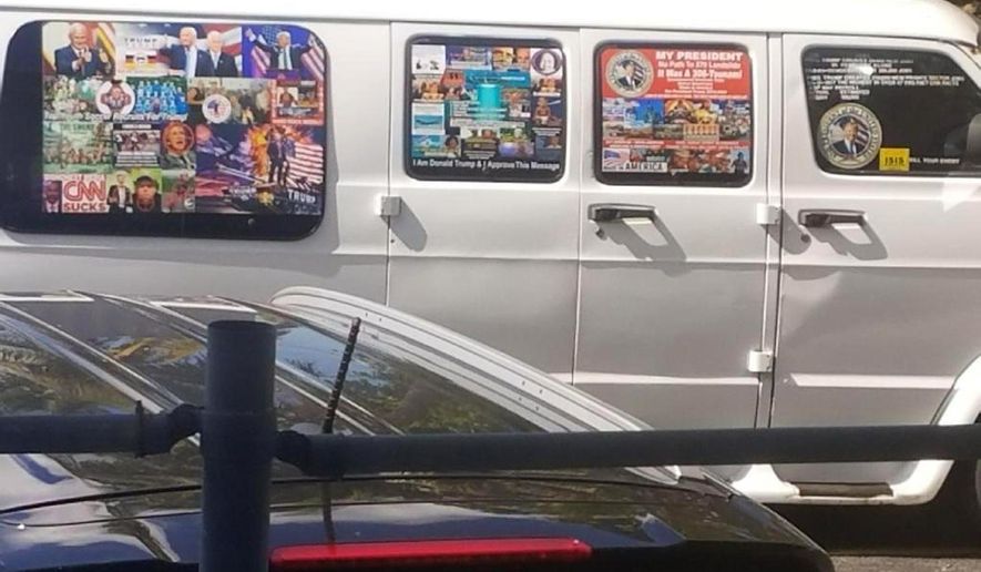This Nov. 1, 2017, photo shows a van with windows covered with an assortment of stickers in Well, Fla. Federal authorities took Cesar Sayoc into custody on Friday, Oct. 26, 2018, and confiscated his van, which appears to be the same one, at an auto parts store in Plantation, Fla., in connection with the mail-bomb scare that has targeted prominent Democrats from coast to coast. (Courtesy of Lesley Abravanel via AP)