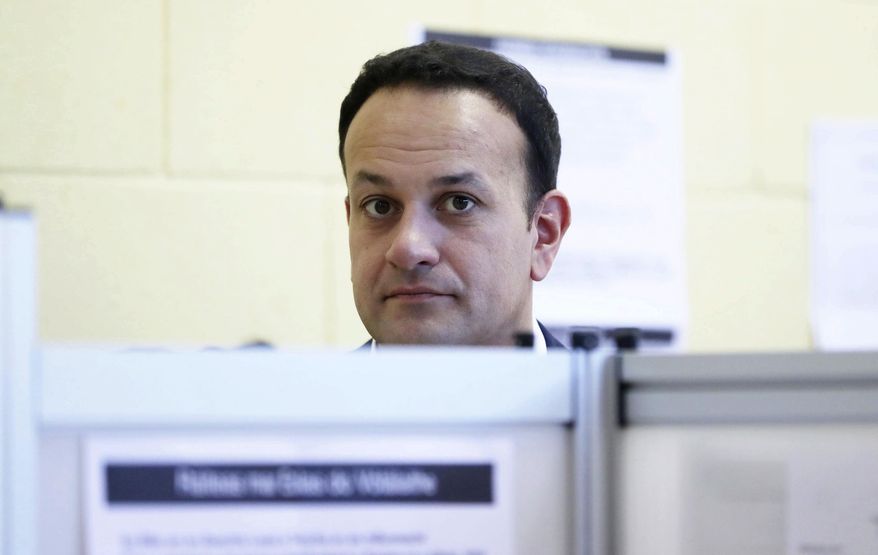 Ireland's Prime Minister Leo Varadkar casts his vote in the Irish Presidential Election, at Castleknock in Dublin, Friday Oct. 26, 2018. Six candidates are competing for the ceremonial post of President, with more than 3.2 million people entitled to vote and the results expected over the coming weekend. (Niall Carson/PA via AP)