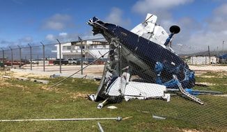 A damaged plane sits at the airport after Super Typhoon Yutu hit the U.S. Commonwealth of the Northern Mariana Islands, Friday, Oct. 26, 2018, in Garapan, Saipan. Residents of the U.S. territory are preparing for months without electricity or running water after the islands were slammed Thursday with the strongest storm to hit any part of the U.S. this year. (AP Photo/Dean Sensui)