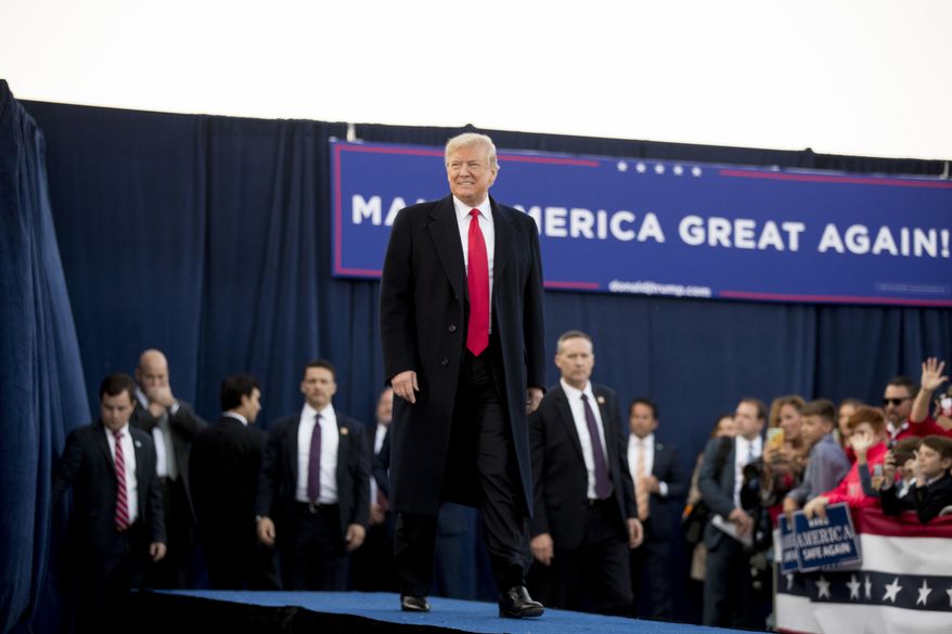 President Donald Trump arrives for a rally at Southern Illinois Airport in Murphysboro, Ill., Saturday, Oct. 27, 2018. (AP Photo/Andrew Harnik)