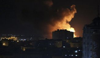 Smoke rises from an explosion caused by an Israeli airstrike on Gaza City, early Saturday, Oct. 27, 2018. Israeli aircraft struck several militant sites across the Gaza Strip early Saturday shortly after militants fired rockets into southern Israel, the Israeli military said. (AP Photo/Adel Hana)