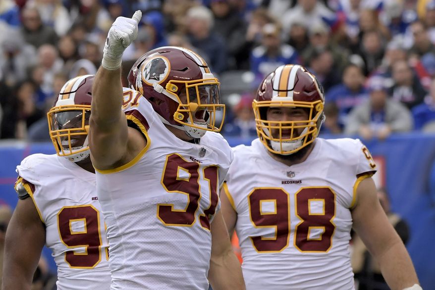 Washington Redskins linebacker Ryan Kerrigan (91) reacts after sacking New York Giants quarterback Eli Manning during the third quarter of an NFL football game, Sunday, Oct. 28, 2018, in East Rutherford, N.J. (AP Photo/Bill Kostroun)