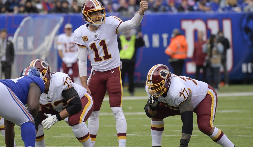 Washington Redskins quarterback Alex Smith (11) calls an audible at the line of scrimmage against the New York Giants during the first quarter of an NFL football game, Sunday, Oct. 28, 2018, in East Rutherford, N.J. (AP Photo/Bill Kostroun)