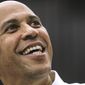 New Jersey Democratic Sen. Cory Booker looks up as he takes a selfie with an attendee after speaking attends at a get out the vote event hosted by the NH Young Democrats at the University of New Hampshire in Durham, N.H. Sunday, Oct. 28, 2018. (AP Photo/ Cheryl Senter)