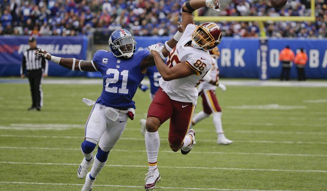 New York Giants strong safety Landon Collins (21) breaks up a pass intended for Washington Redskins tight end Jordan Reed (86) during the third quarter of an NFL football game, Sunday, Oct. 28, 2018, in East Rutherford, N.J. (AP Photo/Seth Wenig)