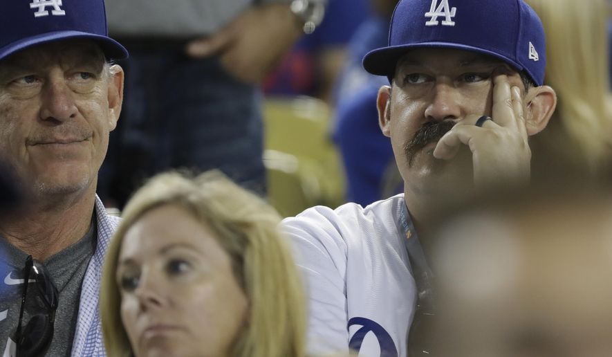Los Angeles Dodgers fans watch Game 4 of the World Series baseball game between the Boston Red Sox and Los Angeles Dodgers on Saturday, Oct. 27, 2018, in Los Angeles. The Red Sox won 9-6. They lead the series 3 game to 1. (AP Photo/David J. Phillip)