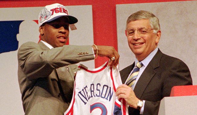 9. Allen Iverson, 1996 Philadelphia 76ers (Georgetown)      Allen Iverson, left, of Georgetown holds up a jersey with NBA commissioner David Stern after being selected as the number one pick in the 1996 NBA draft by the Philadelphia 76ers Wednesday night, June 26, 1996, in East Rutherford, N.J.  (AP Photo/Ron Frehm)  **FILE**